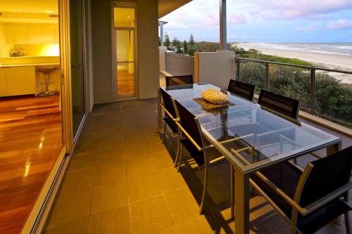 a dining room with a view of the beach at The Beach Cabarita in Cabarita Beach