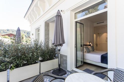 A bed or beds in a room at Villa Eugenia Boutique Hotel