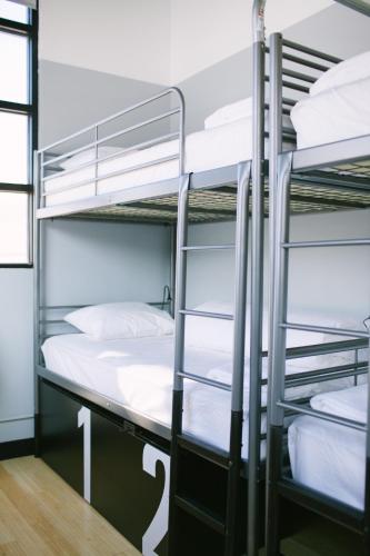 a bunk bed room with two bunk beds at The Local NY in Queens