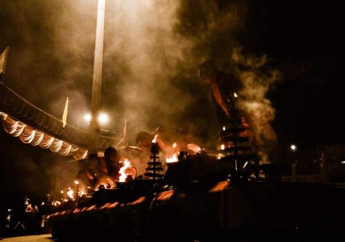 a group of people standing in front of a fire at Hotel Sita Place On Heritage Ghats Of Benaras in Varanasi
