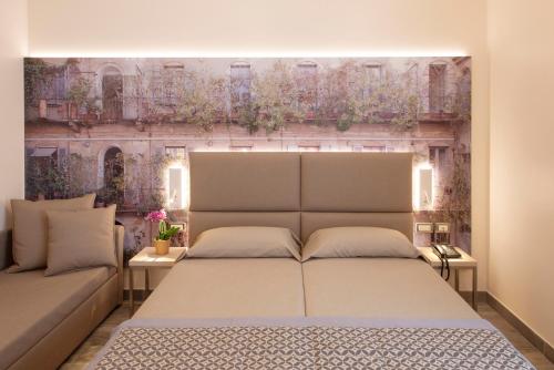 Llit o llits en una habitació de Hotel Sempione