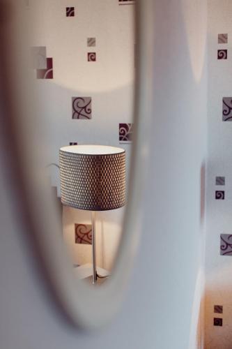 a table in a room with a wall at Landhaus Streeck in Rüggow