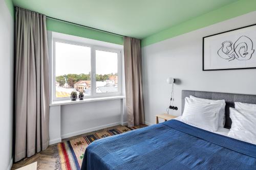 Säng eller sängar i ett rum på Old-New Apartment in Central Kaunas