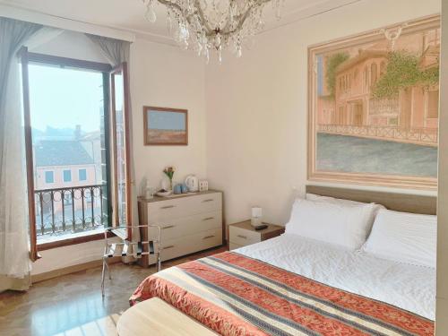 Postel nebo postele na pokoji v ubytování Venezia Canal View