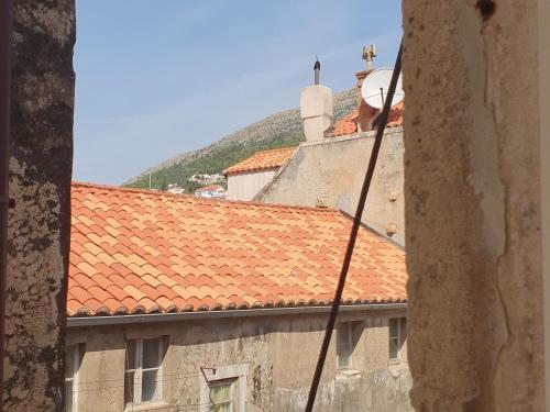 a view of a building with red tile roofs at Rilati palace Dubrovnik 3 in Dubrovnik