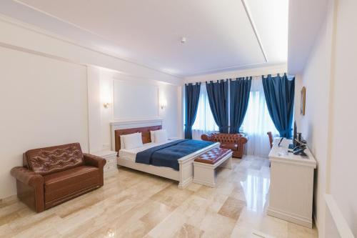 Postel nebo postele na pokoji v ubytování Grand Hotel Palladium
