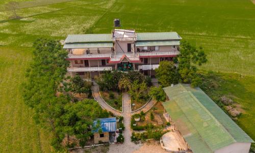 an aerial view of a house with a garden at Hotel Tree Tops in Sauraha