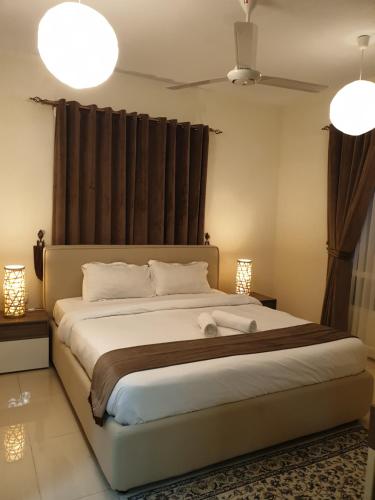 Ліжко або ліжка в номері Muscat Royal Suites