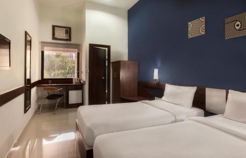 Voodi või voodid majutusasutuse Ginger Pondicherry toas