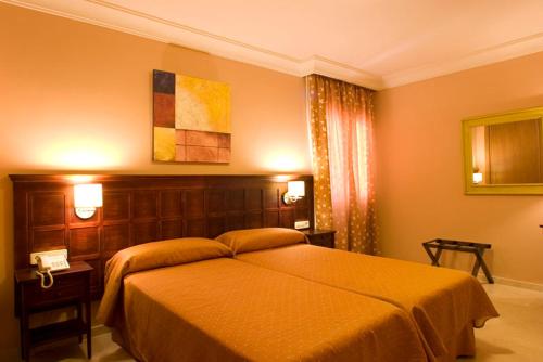 Ένα ή περισσότερα κρεβάτια σε δωμάτιο στο Hotel Sierra Hidalga