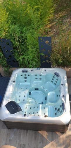 a jacuzzi tub sitting on top of a deck at CasaCosy in Les Michels