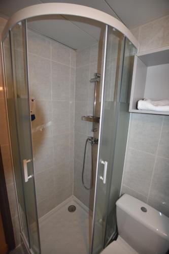 a bathroom with a shower and a toilet at Face West Le Pontet in Le Pontet