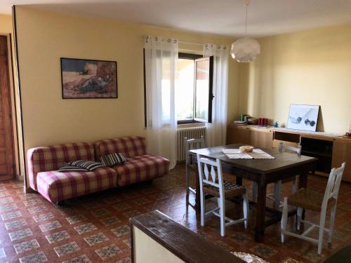 a living room with a couch and a table at Casa Lanze in Castagnole Lanze