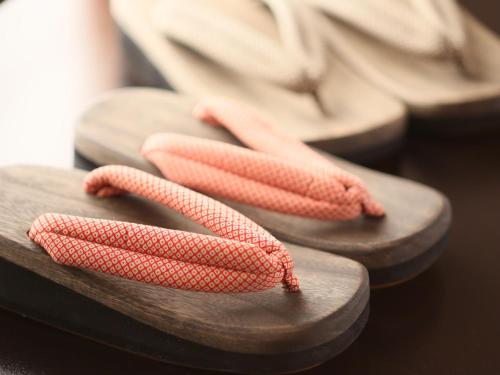 three orange rope on a pair of shoes at Hotel Tamanoyu in Matsumoto