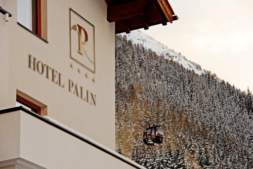 a building with a sign that reads hotel patton park at Hotel Palin in Ischgl