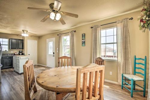 a kitchen and dining room with a wooden table and chairs at half Mi to Sand Surfside Beach Retreat! in Surfside Beach
