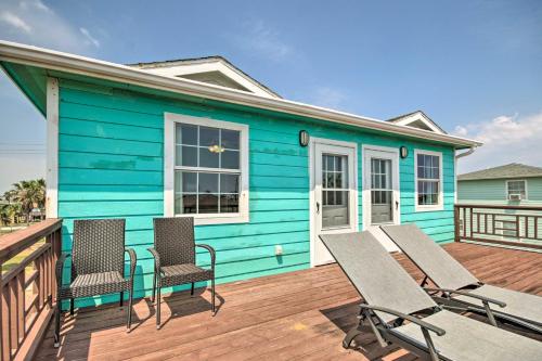 a blue house with chairs on a deck at half Mi to Sand Surfside Beach Retreat! in Surfside Beach
