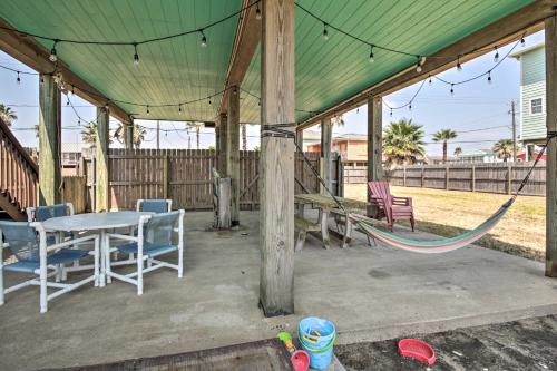 a tent with a table and chairs and a hammock at half Mi to Sand Surfside Beach Retreat! in Surfside Beach
