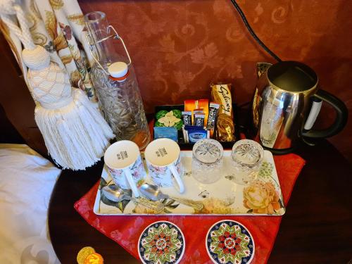 a table with a tray of food and other items at Bluebell House in Inverness