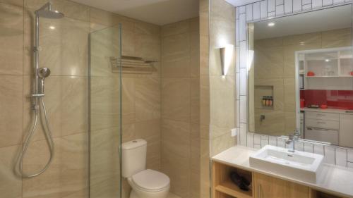 a bathroom with a shower and a toilet and a sink at Atherton Apartments in Atherton
