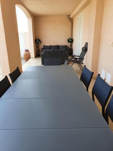 a meeting room with a large table and chairs at casa muriel in Vescovato