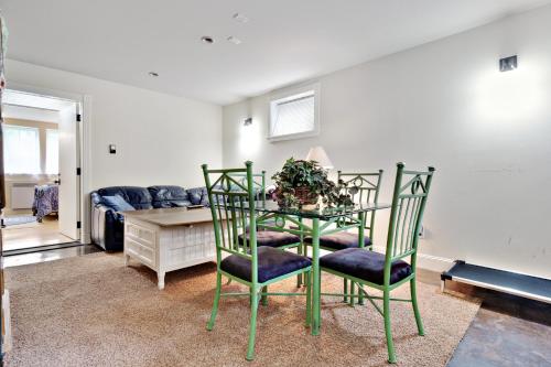 a room with a table with chairs and a couch at 3 Bed 3 Bath Vacation home in Eastsound in Eastsound