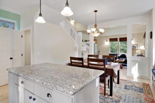 a kitchen and dining room with a table and chairs at 3 Bed 3 Bath Vacation home in Eastsound in Eastsound
