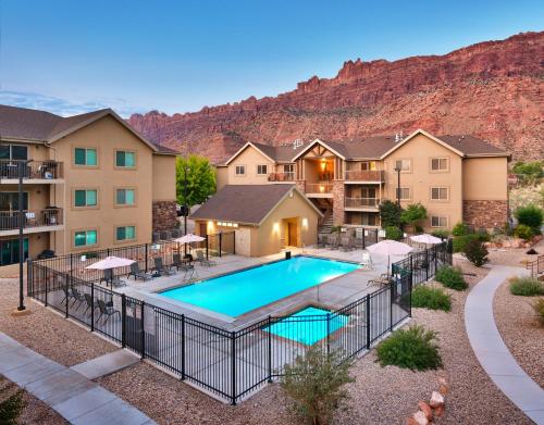 an aerial view of a apartment complex with a swimming pool at 2A Relaxing Redcliff Condo in Moab