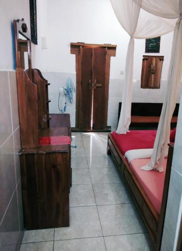 a room with two beds and a shower in it at Volcano Living in Kintamani