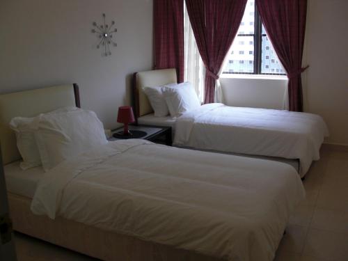 Cama o camas de una habitación en 8 O'Clock Condo Service - Bandar Utama, PJ - Kuala Lumpur