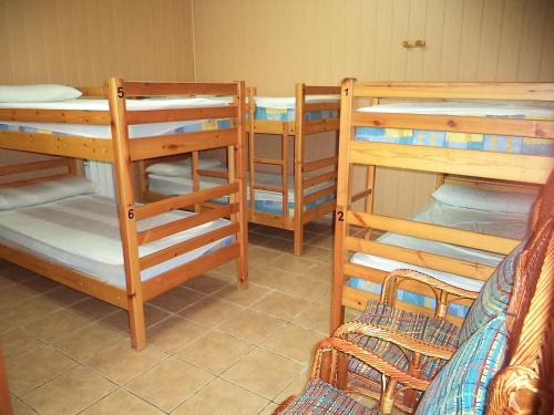 a group of bunk beds in a room at Albergue de Peregrinos A Santiago in Belorado