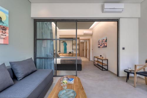 a living room with a couch and a table at Muse Urban Suites in Athens