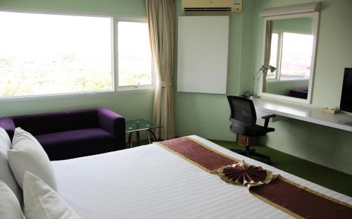 V Verve Service Apartment Hotelにあるベッド