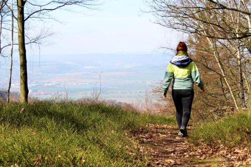 a woman walking up a hill on a trail at Burghof Kyffhäuser in Bad Frankenhausen