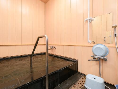 a bathroom with a sink and a toilet at Tabist Asanokan Annex Iroha Ise in Ise