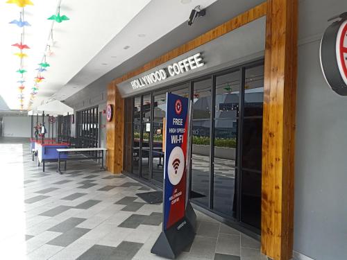 a entrance to a mallory coffee shop with a sign on the door at D'Gunduls Homestay STUDIO by DGH I-CITY in Shah Alam