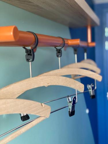 a row of wooden shelves with metal pulls at ibis Budget Mâcon Crêches in Chaintré