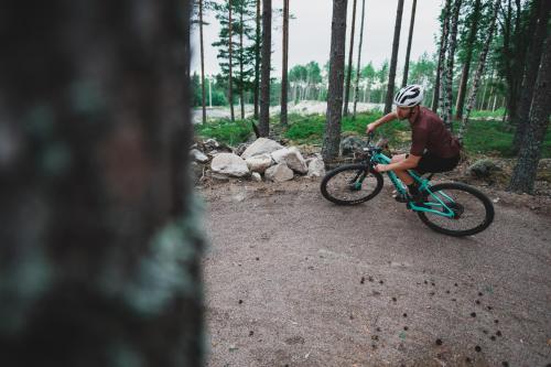 a man riding a bike on a dirt road at Snöå Bruk Hotell och konferens in Dala-Järna