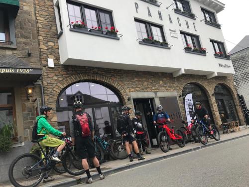 a group of people standing outside of a building at PANACHE - BIKE EN SLEEP HOTEL in La Roche-en-Ardenne