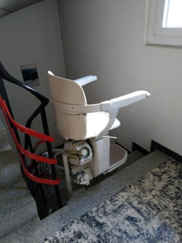 a white toilet in a corner of a room at Aurora 2 in Leukerbad
