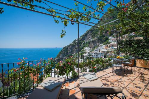 a balcony with a view of the amalfi coast at Hotel Punta Regina in Positano