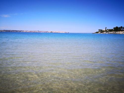 a view of a large body of water at Nido Colorato Guest House in Fontane Bianche