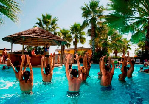 a group of people in the water at a swimming pool at Hotel Europa Beach Village in Giulianova