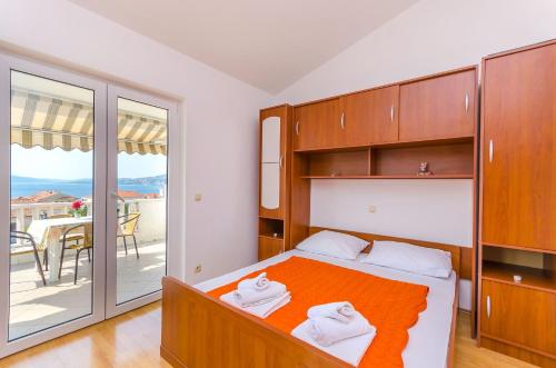 Postel nebo postele na pokoji v ubytování Apartments Tily