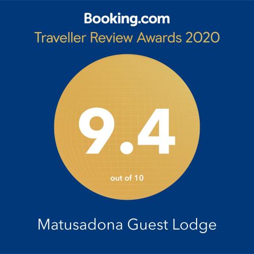 a yellow circle with the number four and the text travelling review awards at Matusadona Guest Lodge in Hillcrest