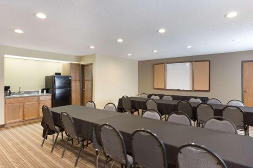 a conference room with a large table and chairs at Quality Inn in Athens