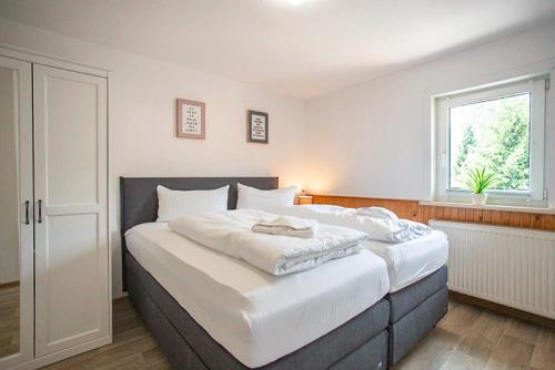 Postel nebo postele na pokoji v ubytování Ferienhaus an der Brockenbahn