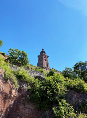 a stone tower on top of a mountain at Burghof Kyffhäuser in Bad Frankenhausen