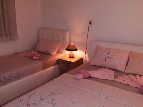 Postel nebo postele na pokoji v ubytování City Center Apartment JOTIC