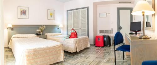 Katil atau katil-katil dalam bilik di Hotel Abades Manzanil